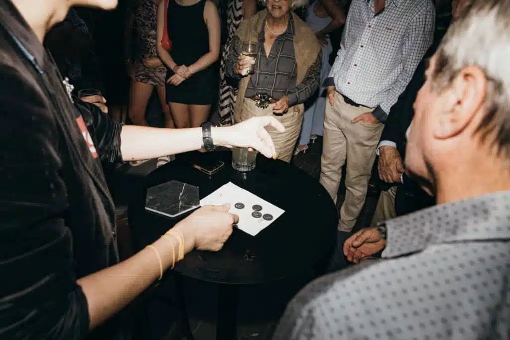 Perth Magician Toby Z. performing live magic at an event.